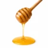 Lychee honey dripping from a wooden dipper - Eco Foods