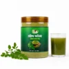 Moringa Powder 250 G jar with glass of moringa drink - Eco Foods